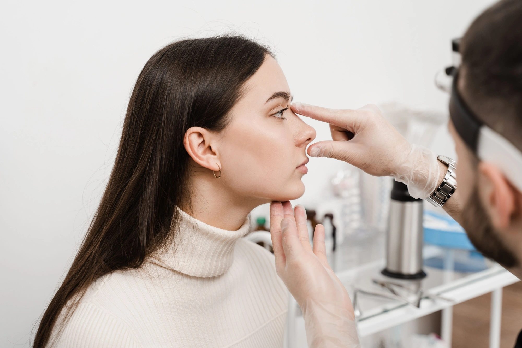 A woman getting a medical dressing on her nose after a septoplasty in Houston