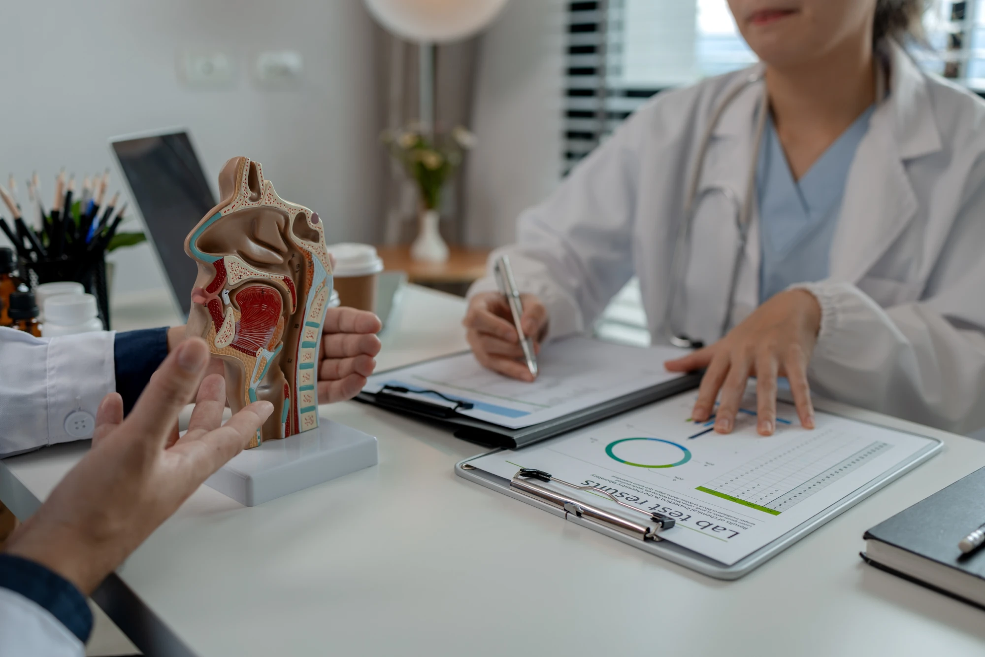 Houston ENT reviewing first visit results and treatment plan with patient