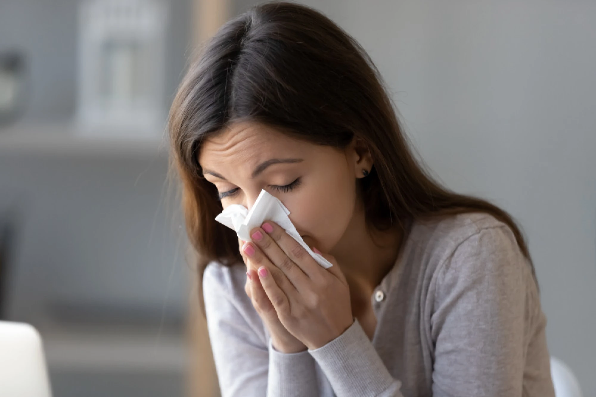 A woman experiencing chronic rhinitis