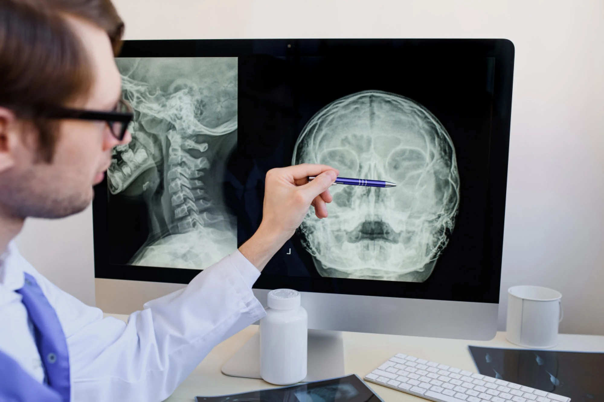A physician reviewing a patient’s sinus medical imaging