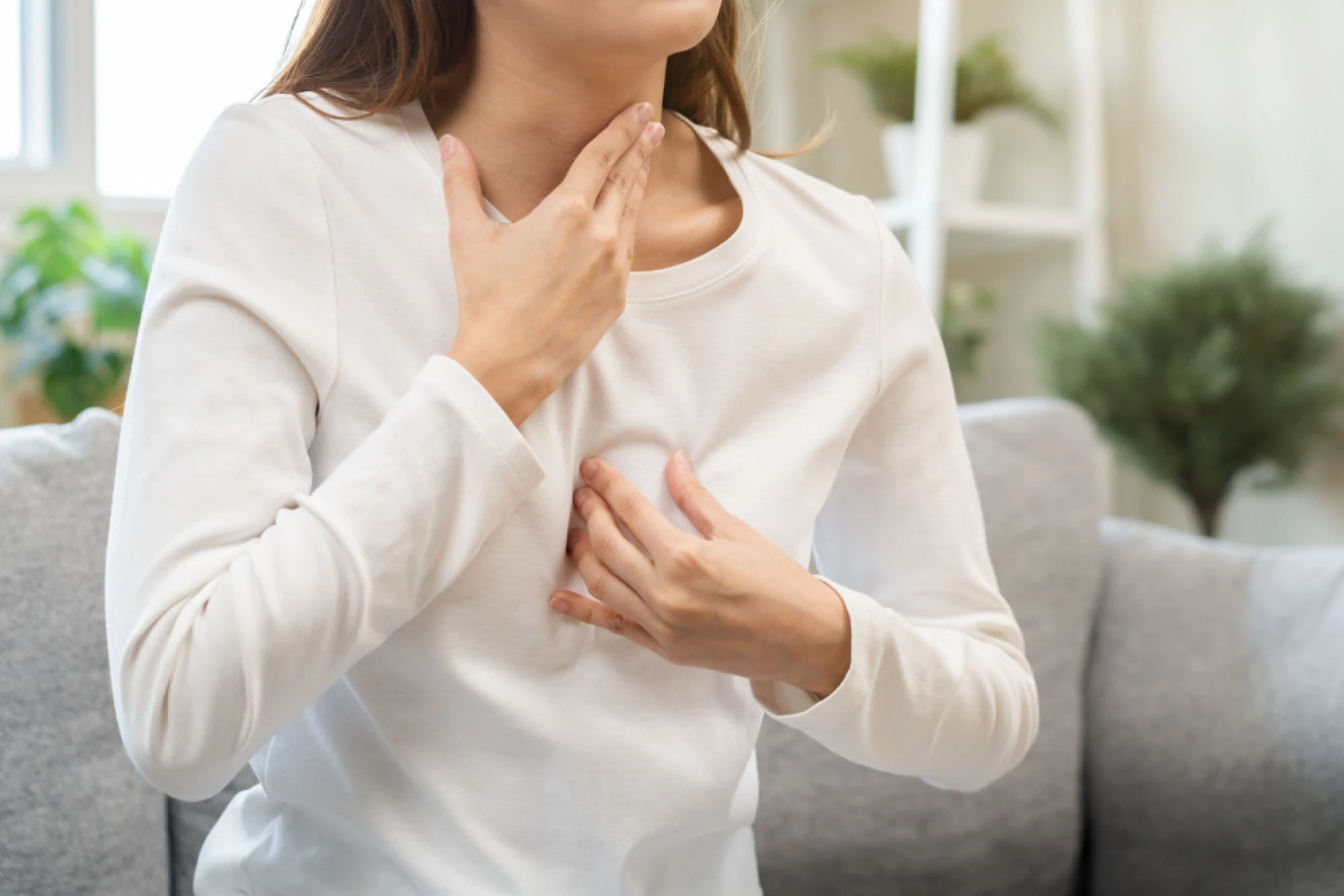 A woman experiencing GERD symptoms related to sinusitis