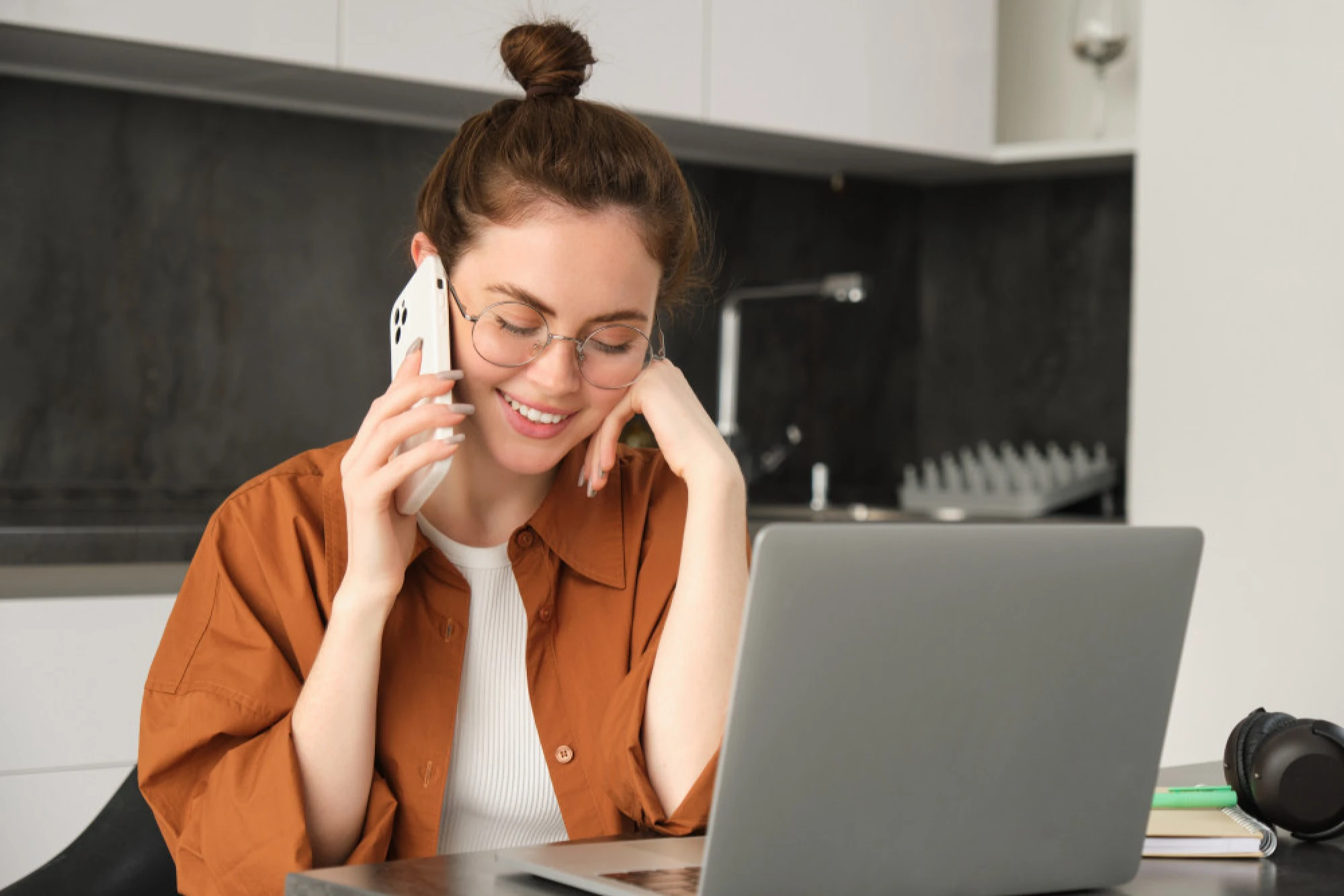 A woman calling to schedule an appointment at an ENT in Houston
