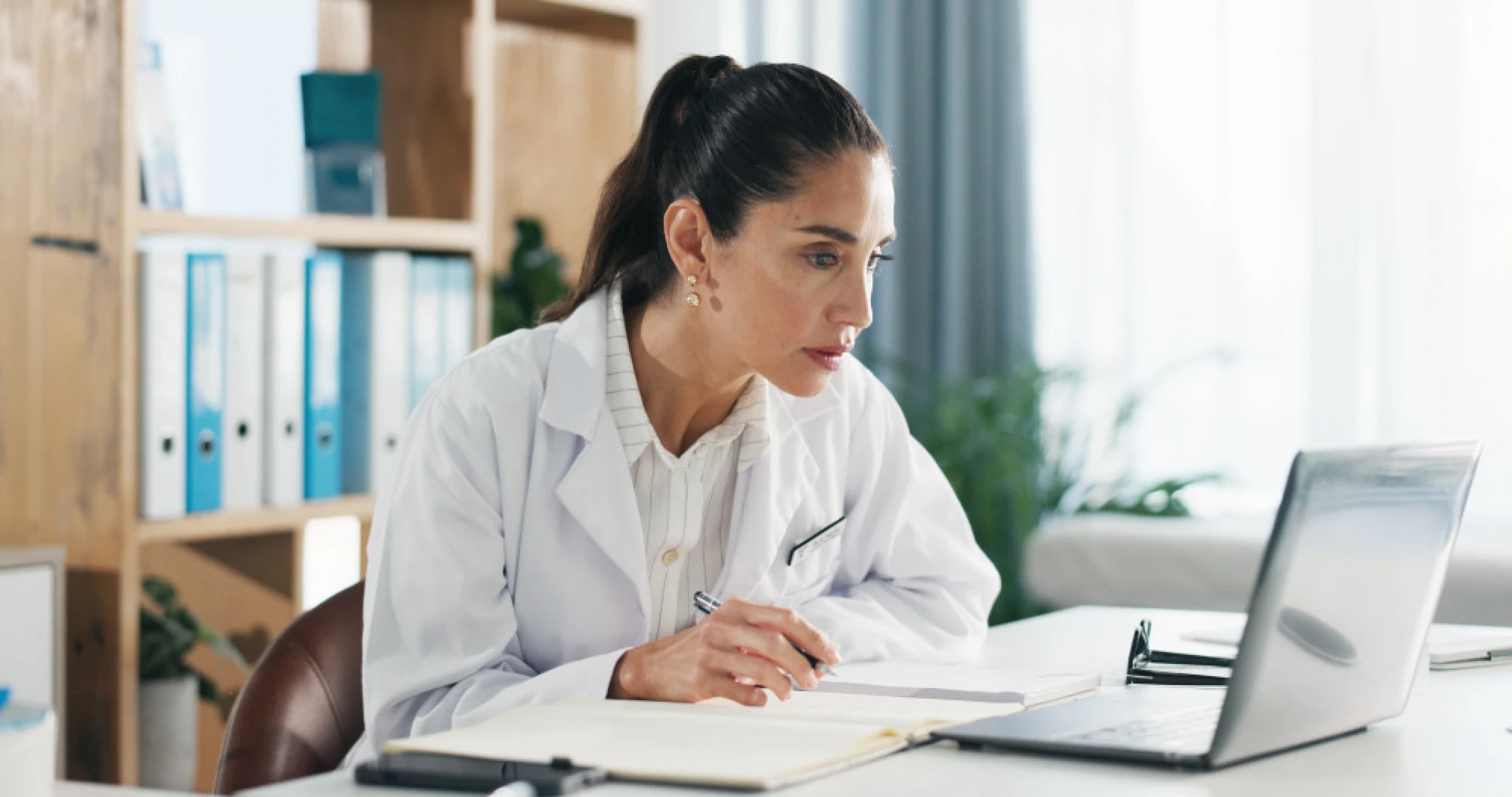 An ENT doctor in Houston on her laptop
