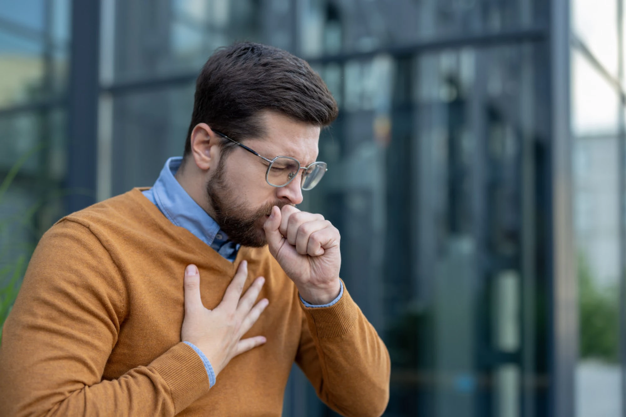 Professional businessman clearing his throat
