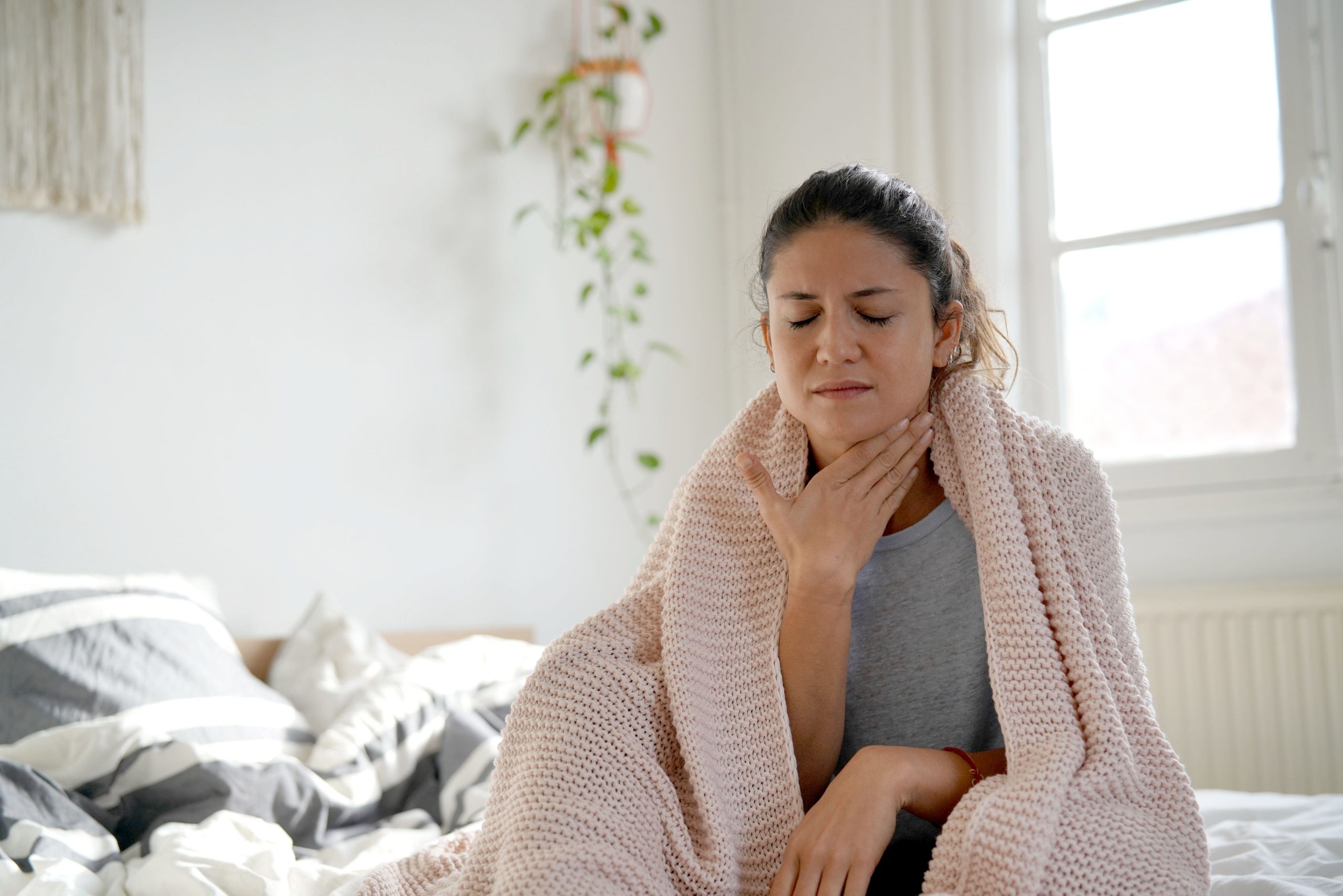 Woman with sore throat